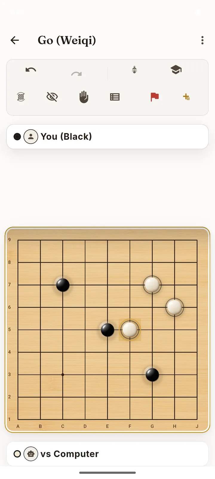 Boardlore Go board on a nine-by-nine grid, black and white stones mid-game